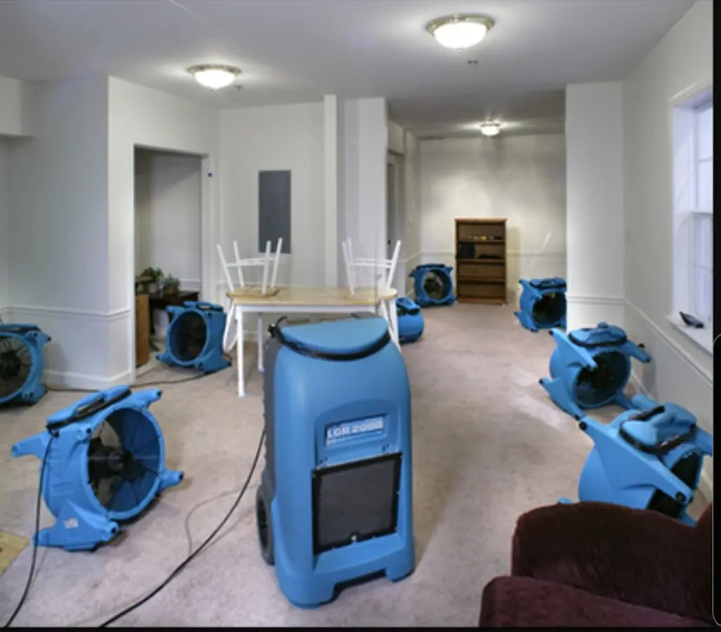 Air movers and dehumidifier setup for Water Damage Restoration in Millbury